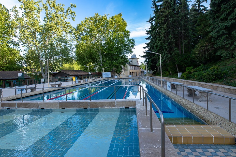 The 55-meter-long, gradually deepening outdoor pool of Csillaghegyi thermal bath in Budapest