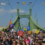People marching on the Liberty Bridge during Budapest Pride