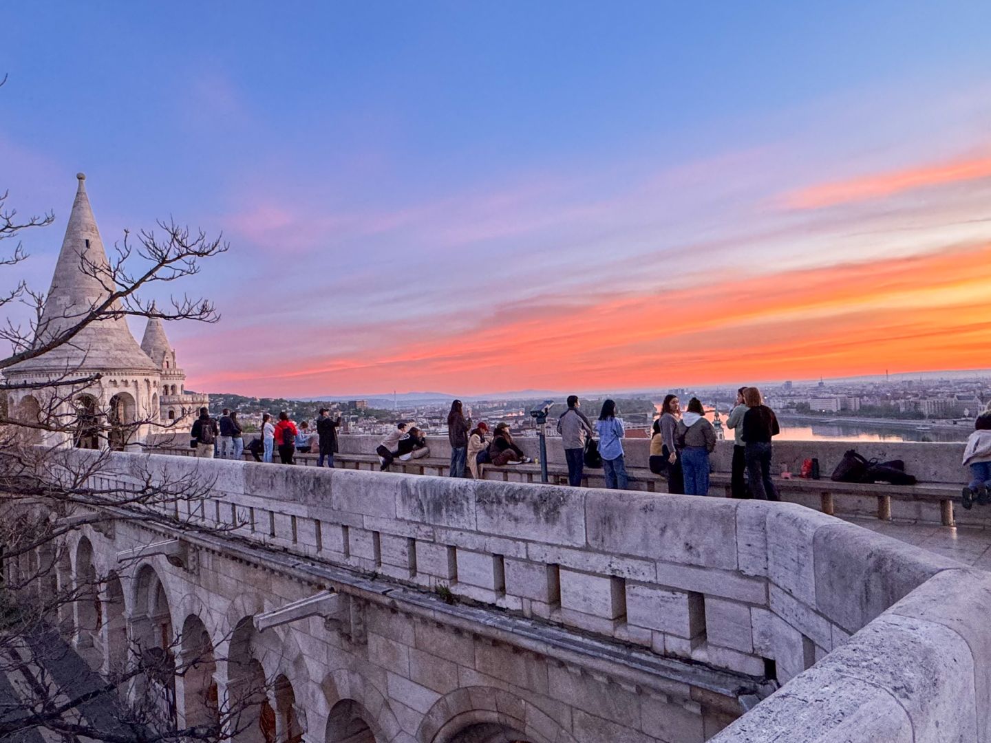 Tourists admiring the dawn at Fisherman's Bastion.