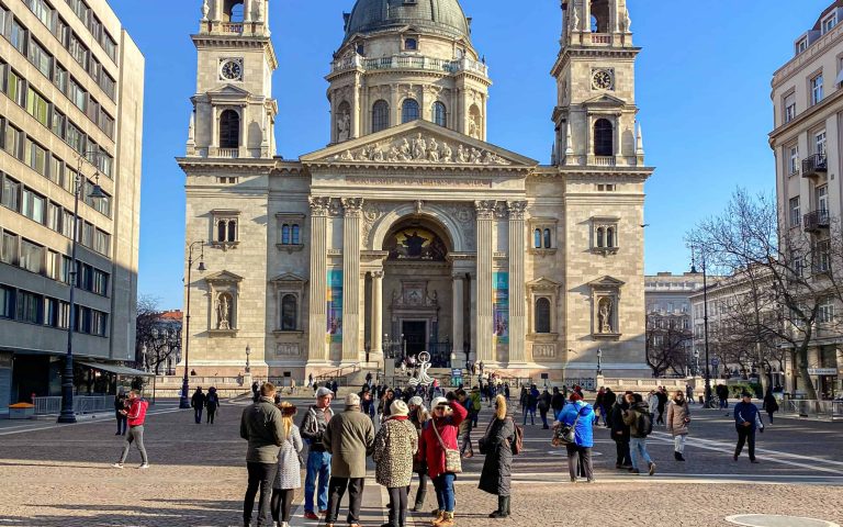 A guided tour group in front of St. Stephen's Basilica