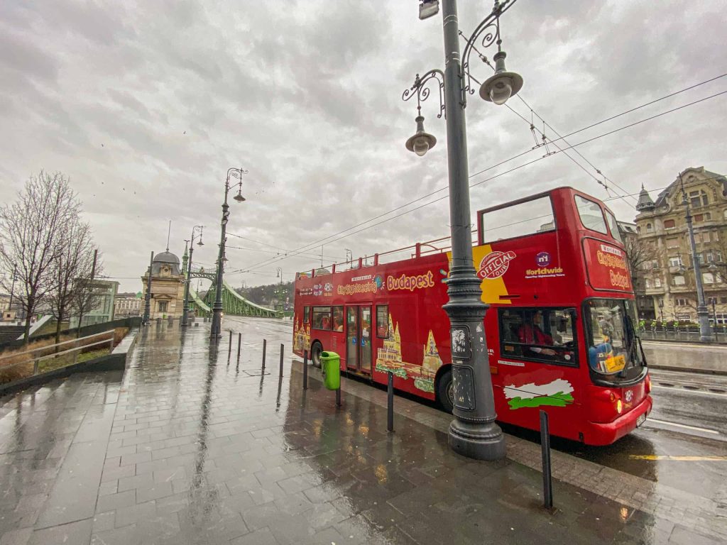 Hop-on-hop-off-bus-Great-Market-Hall-sightseeing-red-bus