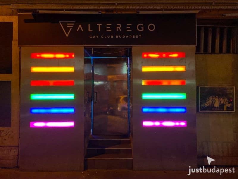 The neon-lit dance floor and disco ball inside the AlterEgo gay club