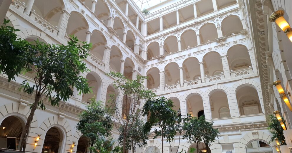 The fiercely ornate, Renaissance-style marble lobby of the Anantara New York Palace Hotel