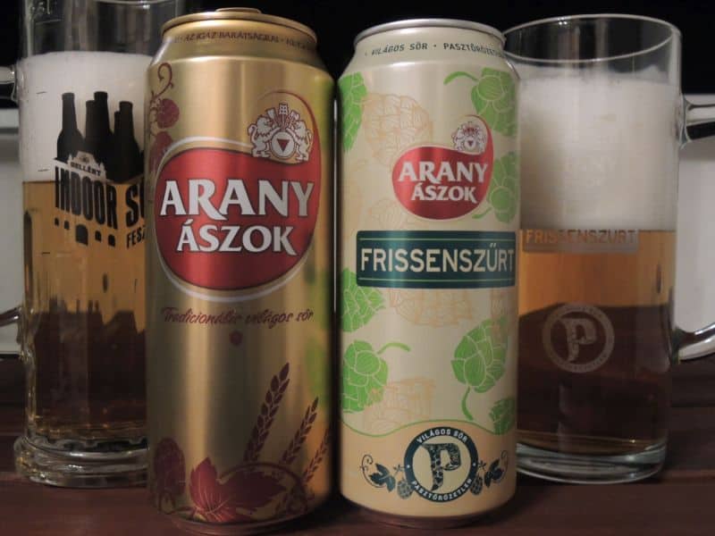 A tall aluminum can of Arany Ászok pale lager