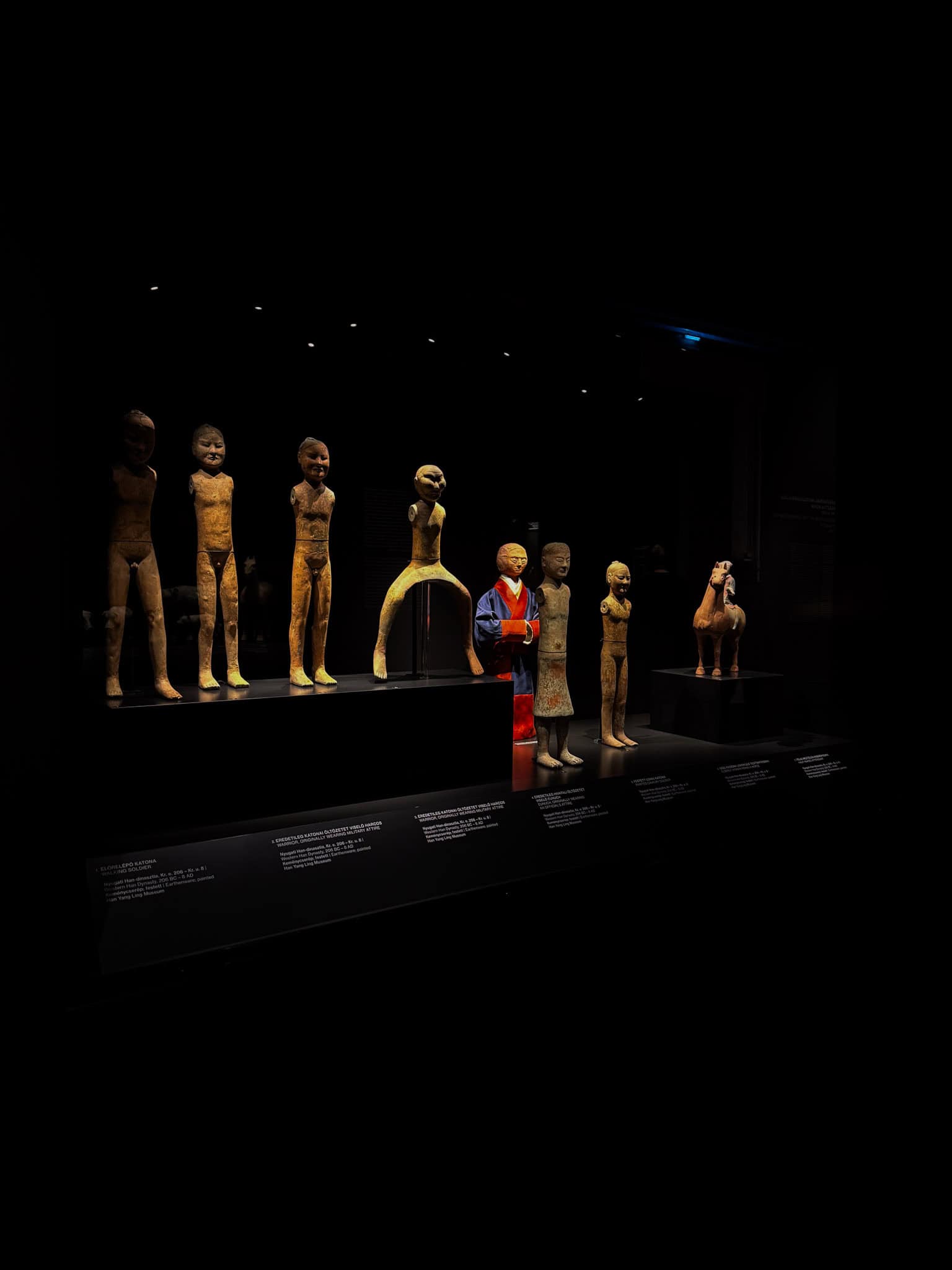 Miniature pottery figures missing their wooden arms