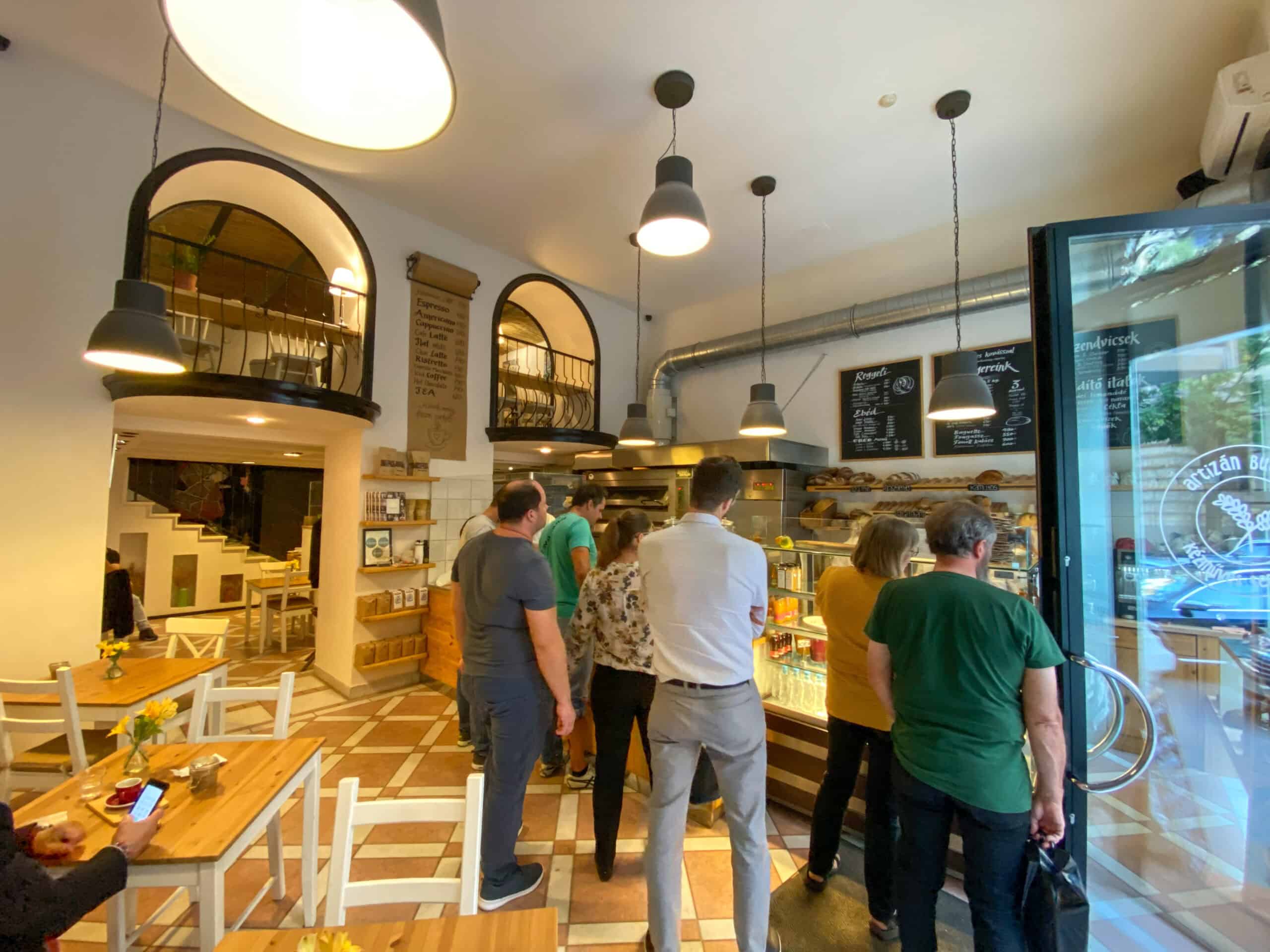 A display of fresh artisanal breads and pastries at a Budapest bakery