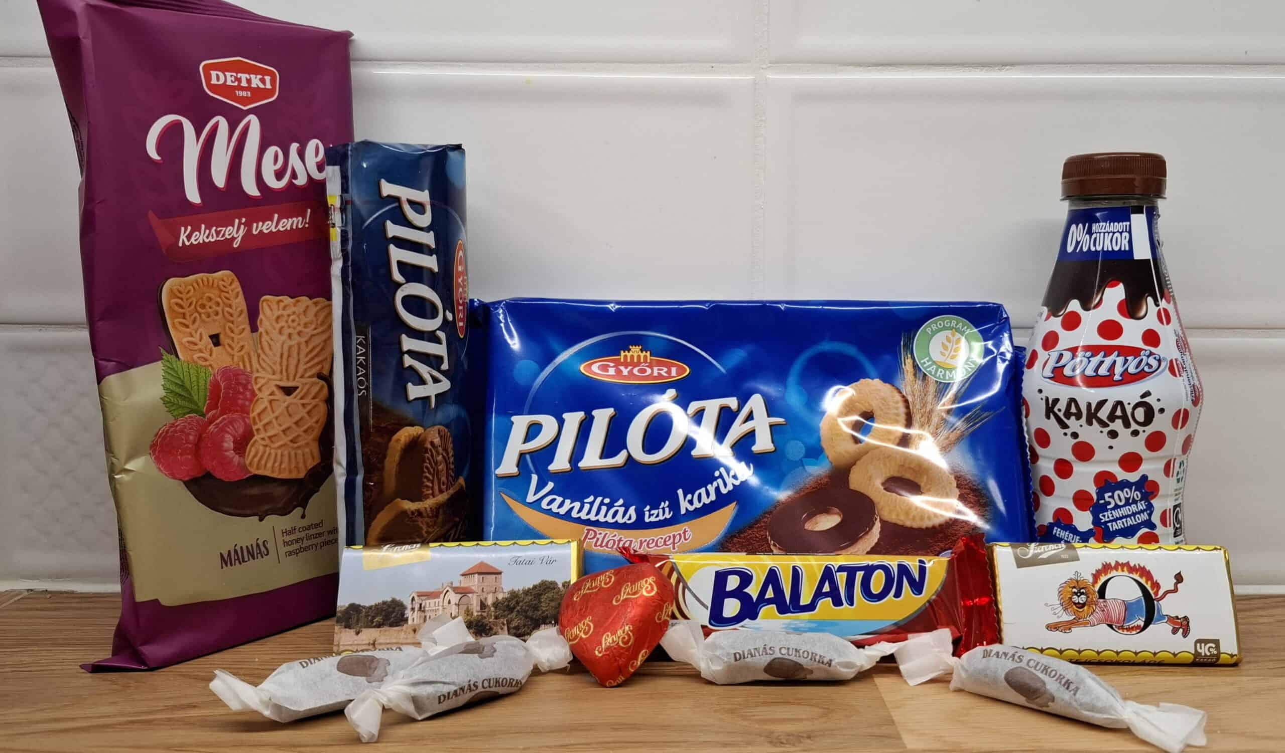 A sprawling table spread featuring various traditional Hungarian bakery snacks