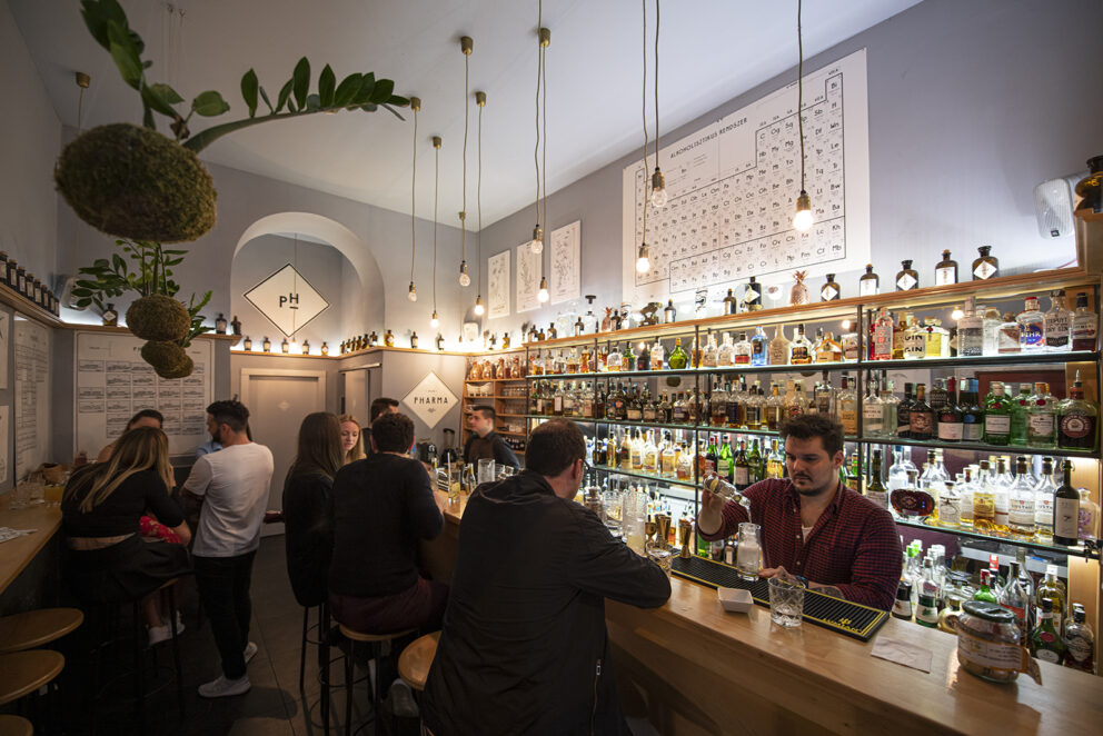 Brightly colored cocktails served in chemistry test tubes at Bar Pharma
