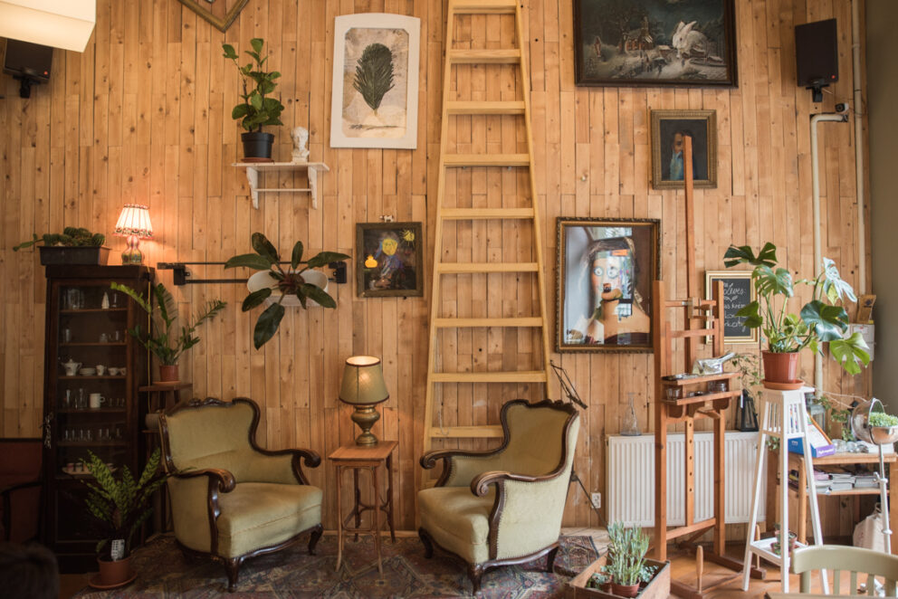 A peaceful reading nook with bookshelves inside Béla bar