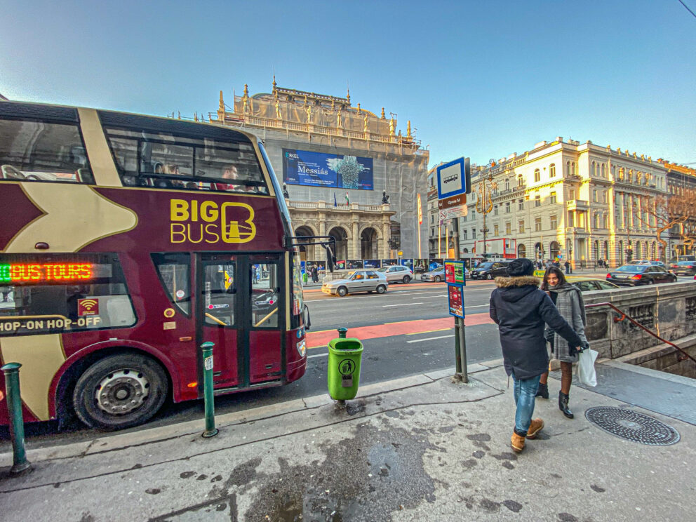 A Hop-on Hop-off bus parked in front of the Opera House