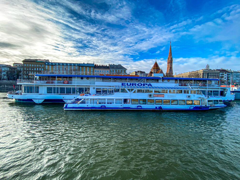 A BKK public ferry docked at Batthyány Square waiting for passengers to board