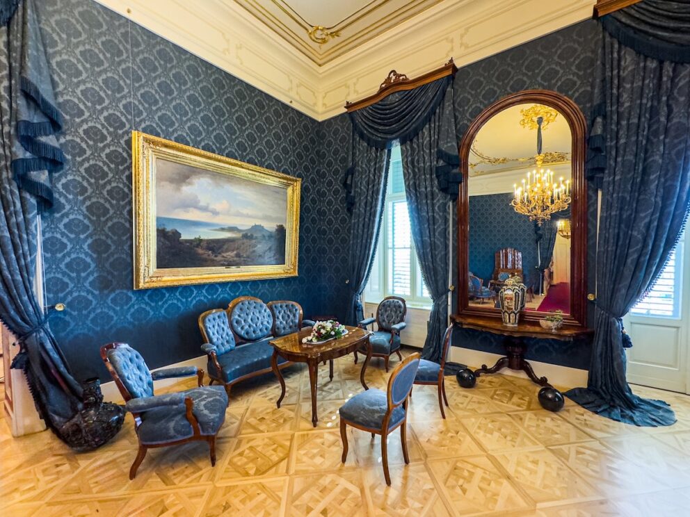 A comfortable, elegant seating area in the Blue Salon