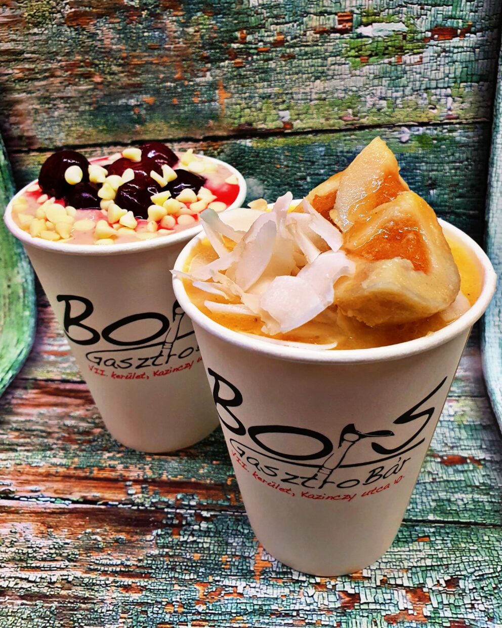 Two paper cups filled with sweet, brightly colored fruit soups from Bors GasztroBar