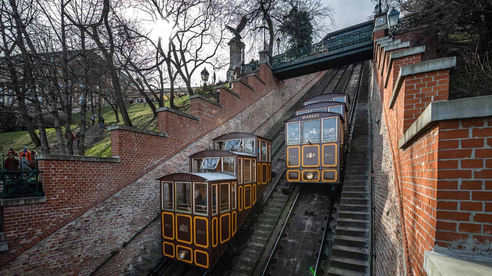 The historic safely wooden carriage of the local Castle Hill Funicular ascending smoothly up the tracks
