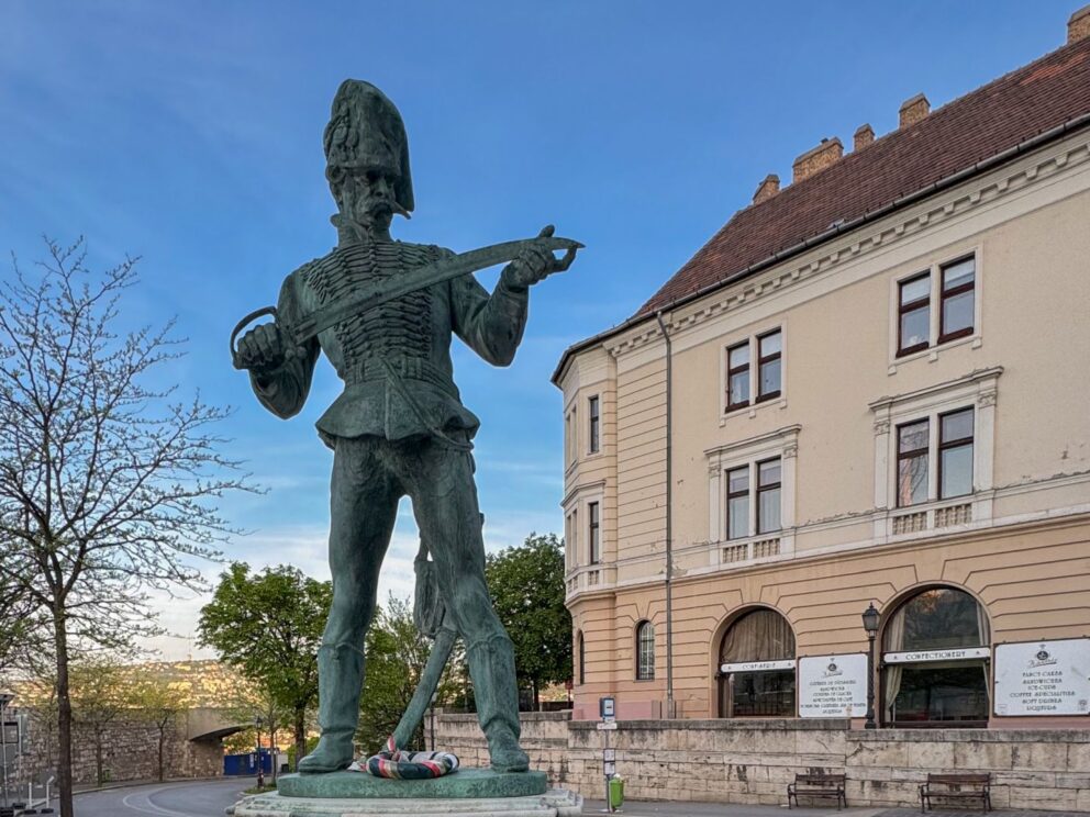 The impressive Old Hussar Statue located within the historic Buda Castle District in Budapest