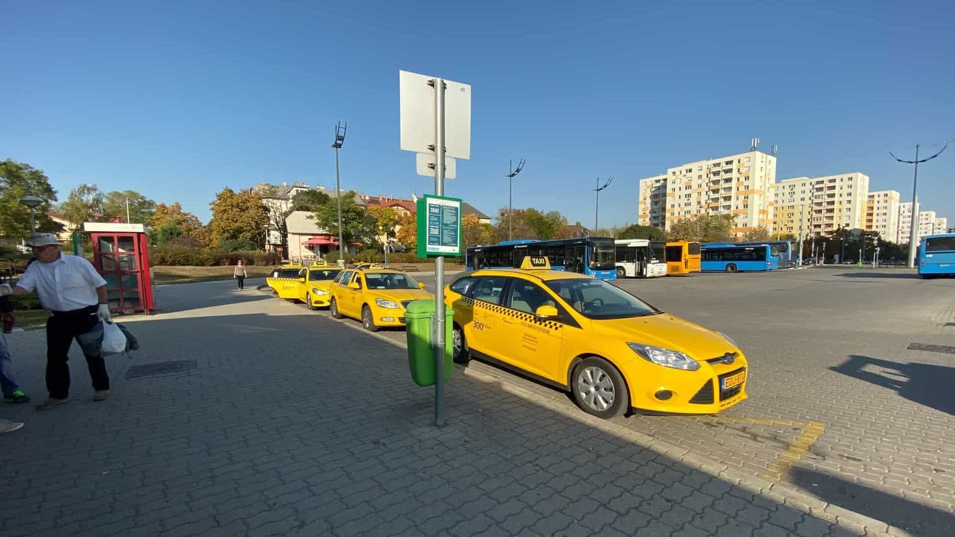 Yellow Budapest taxis lined up at the official airport taxi rank in Terminal 2
