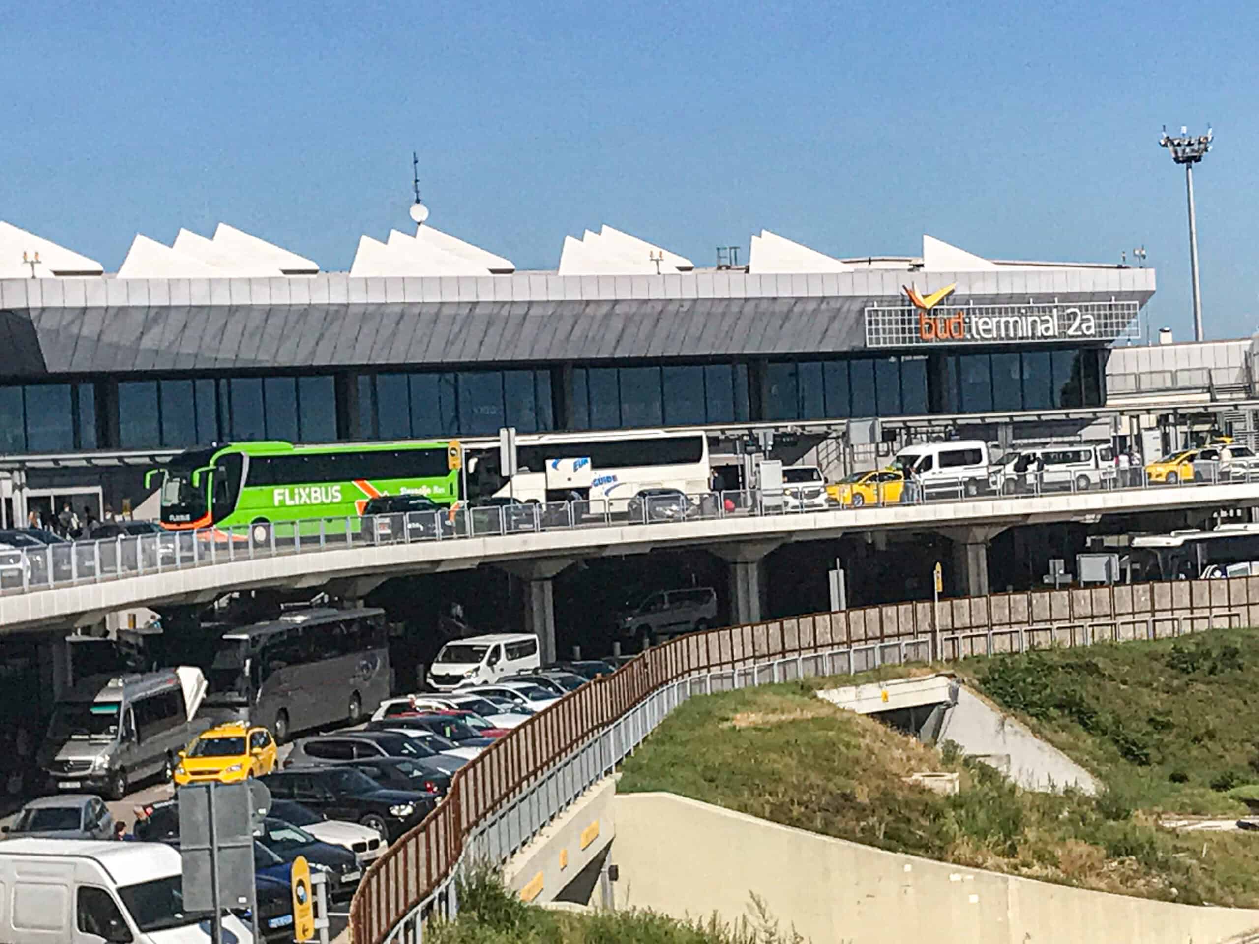 The modern glass facade of the passenger terminal at Budapest Airport