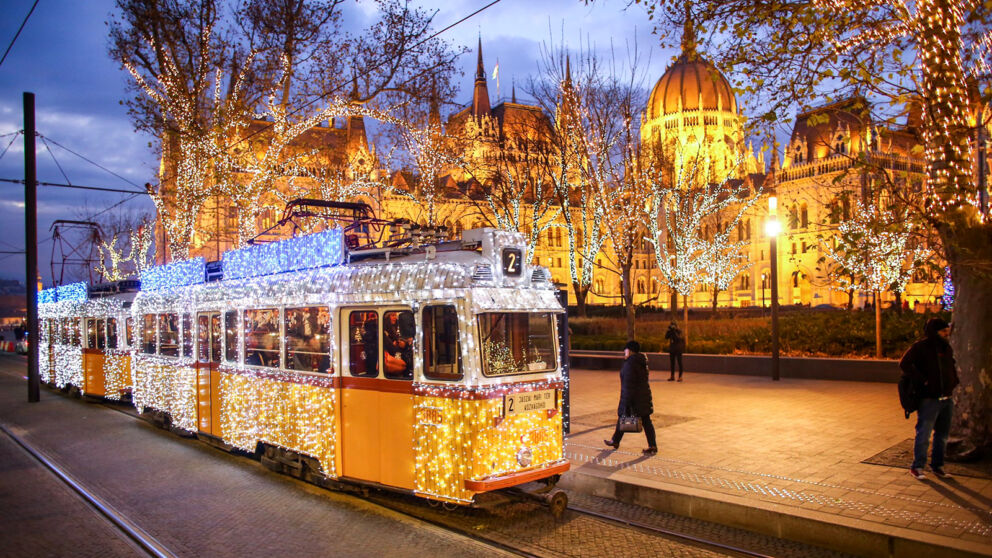 Illuminated Christmas Tram in front of the Parliament building