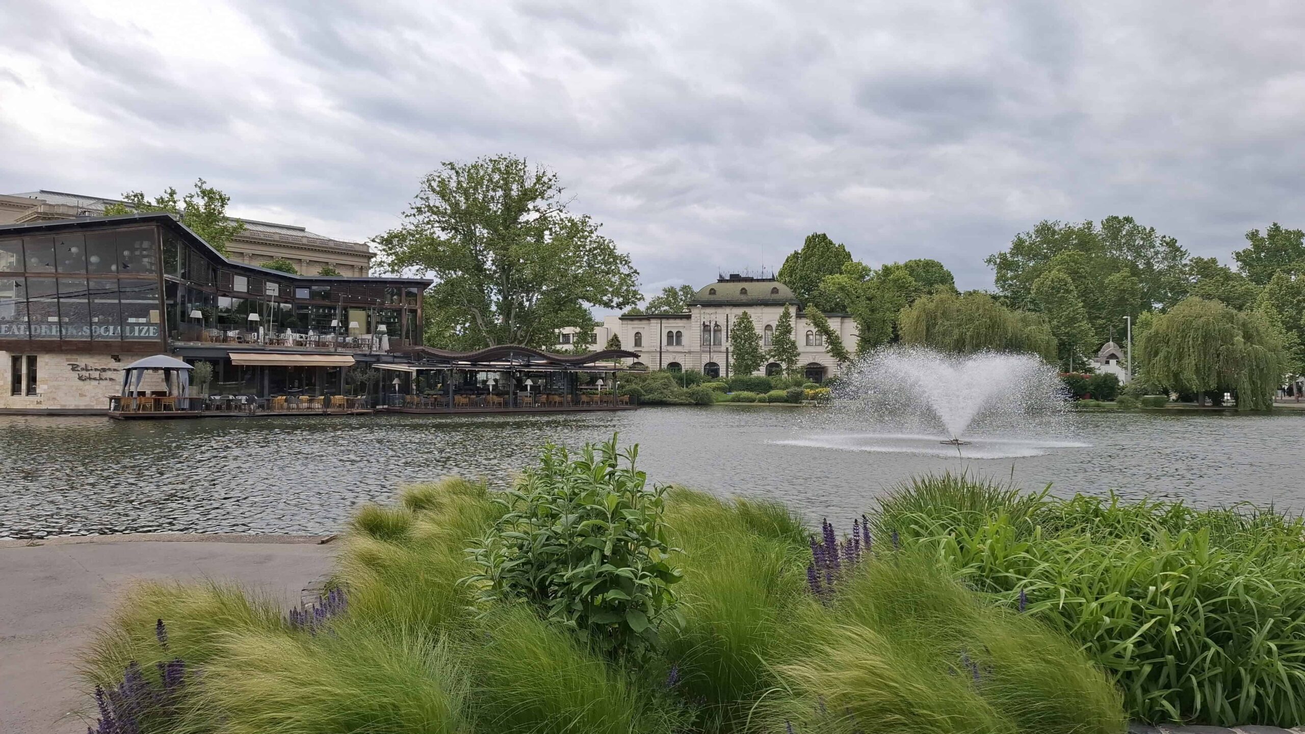 People enjoying romantic boat rides on the large lake in the middle of Budapest City Park