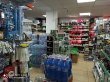 The packed interior of a small grocery and convenience store