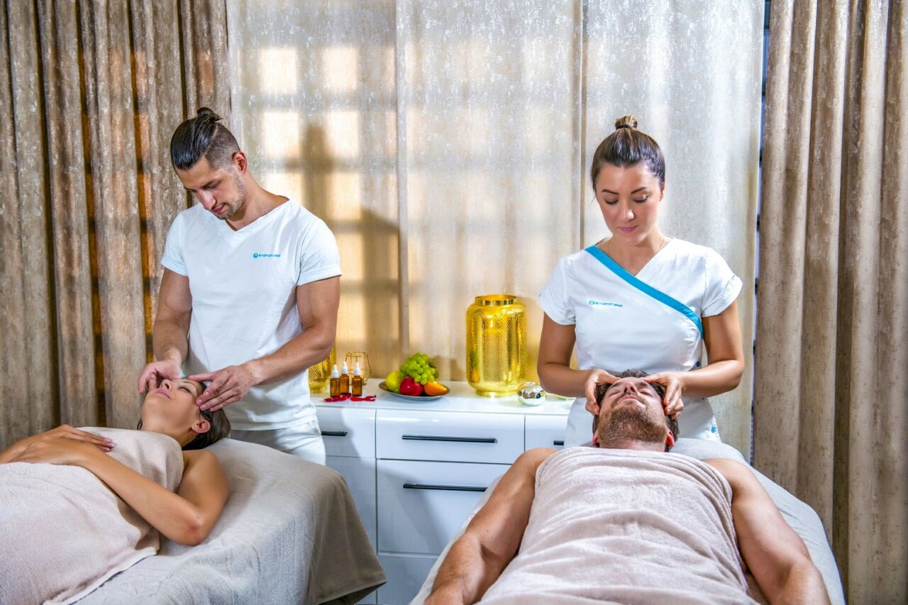 An expert therapist applying firm pressure during a deep tissue massage session