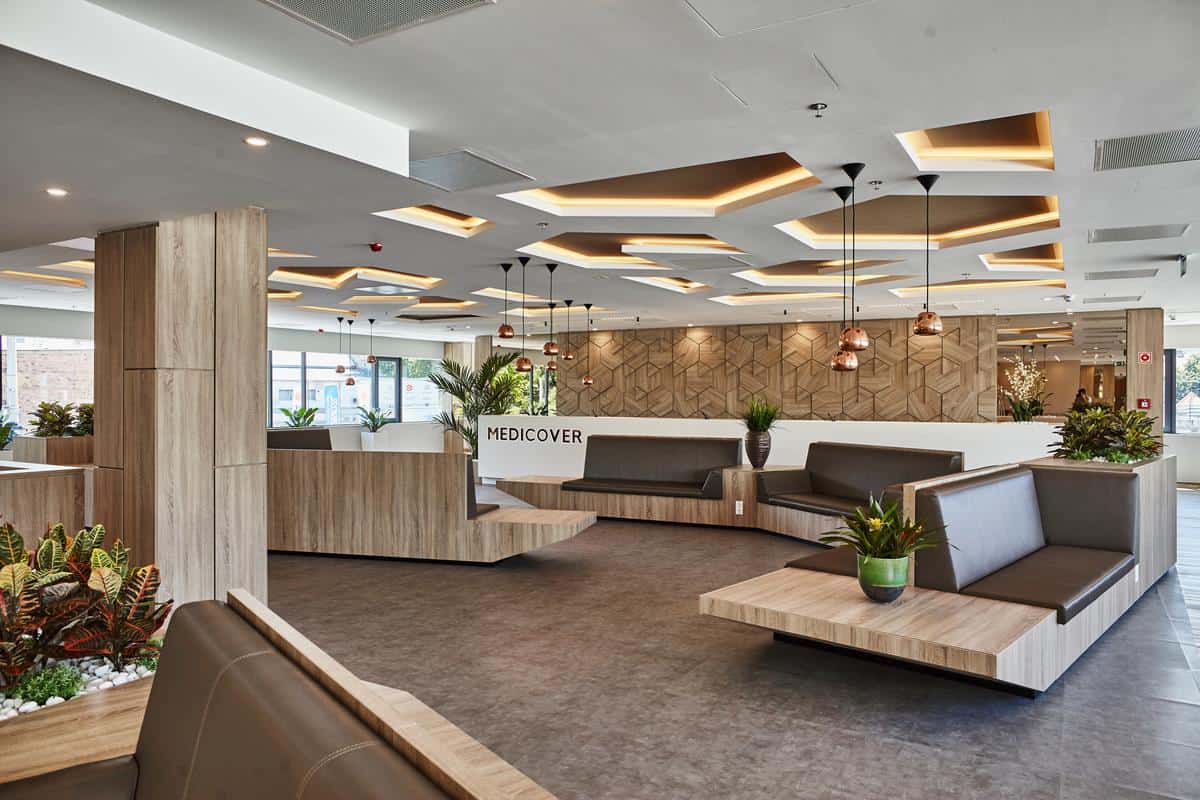 Experienced European dental surgeons performing advanced implant surgery in a sterile room