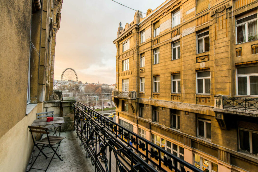A sunny view of downtown Budapest from a balcony of a classical apartment building