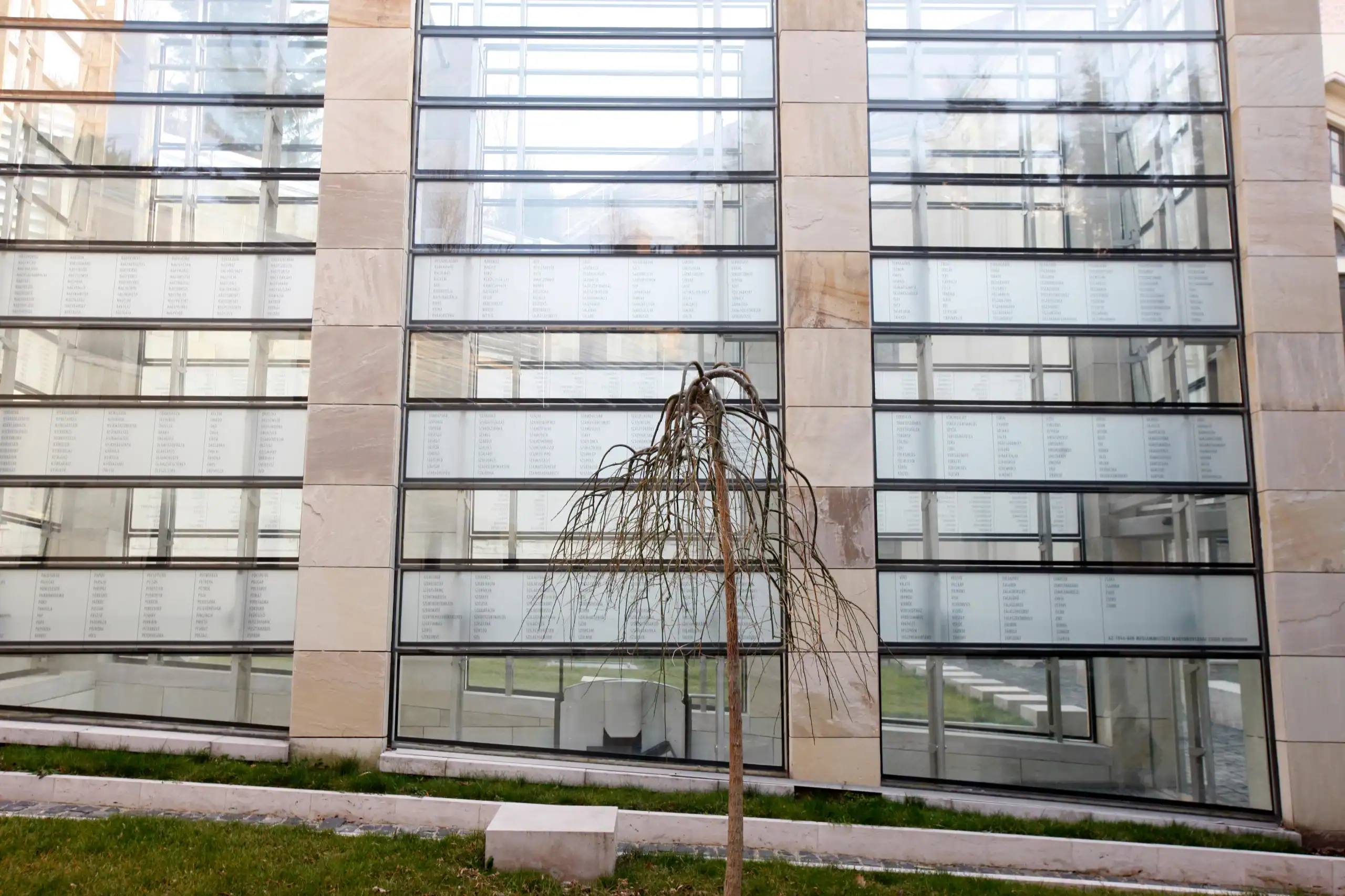 The massive, multi-story glass gallery wall connecting the modern museum buildings