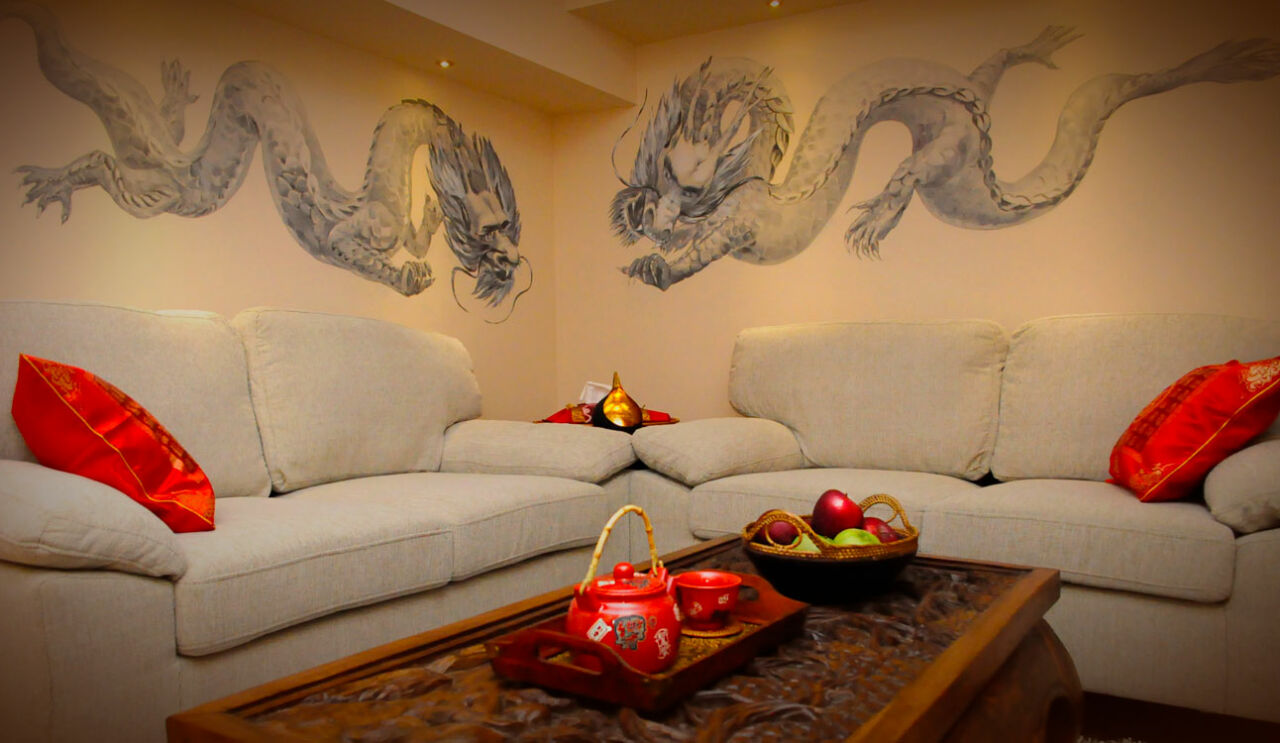 A relaxed couple enjoying a professional hot oil massage together at a luxury spa