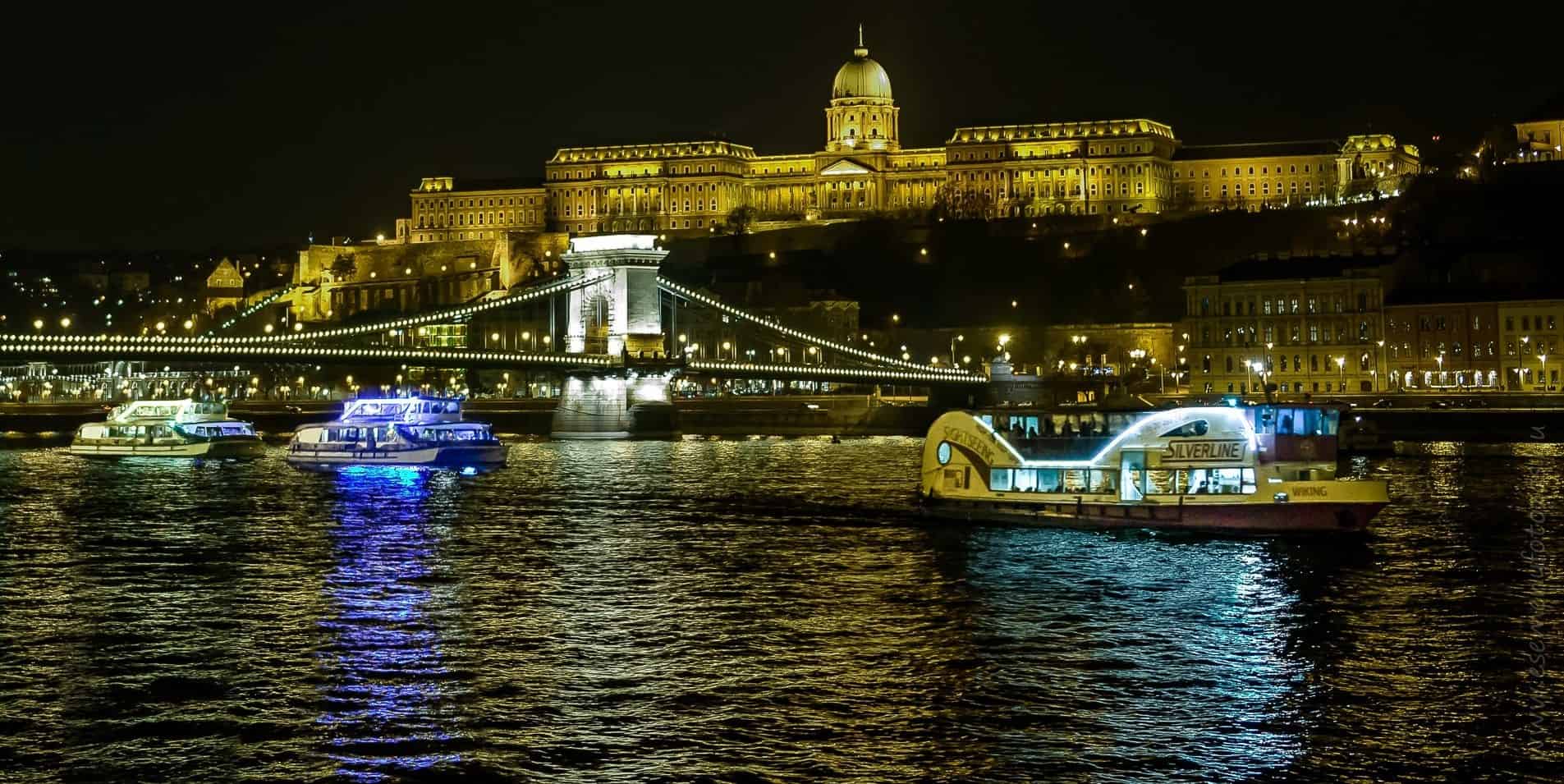 Viewing the beautifully illuminated Parliament from a river cruise boat on the Danube