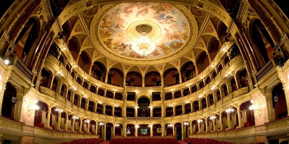 The magnificent marble double grand staircase inside the Budapest Opera House