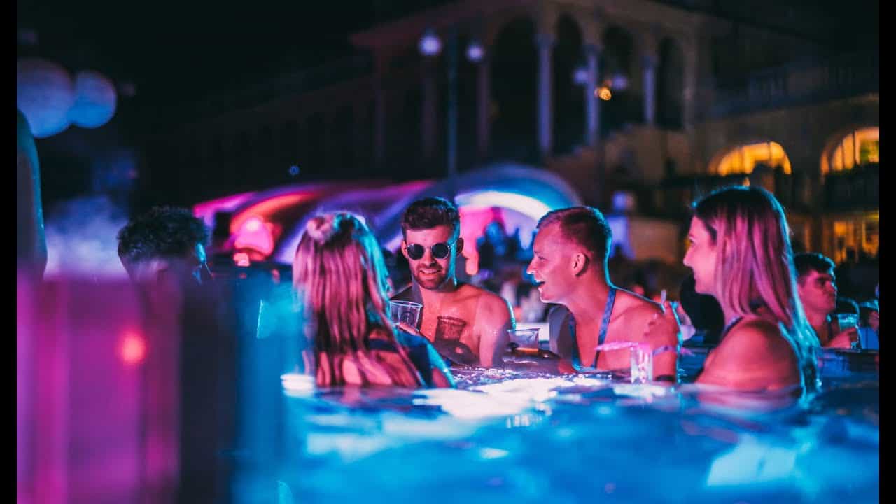 Incredible green and pink laser lights and sparklers illuminating the Budapest bath party