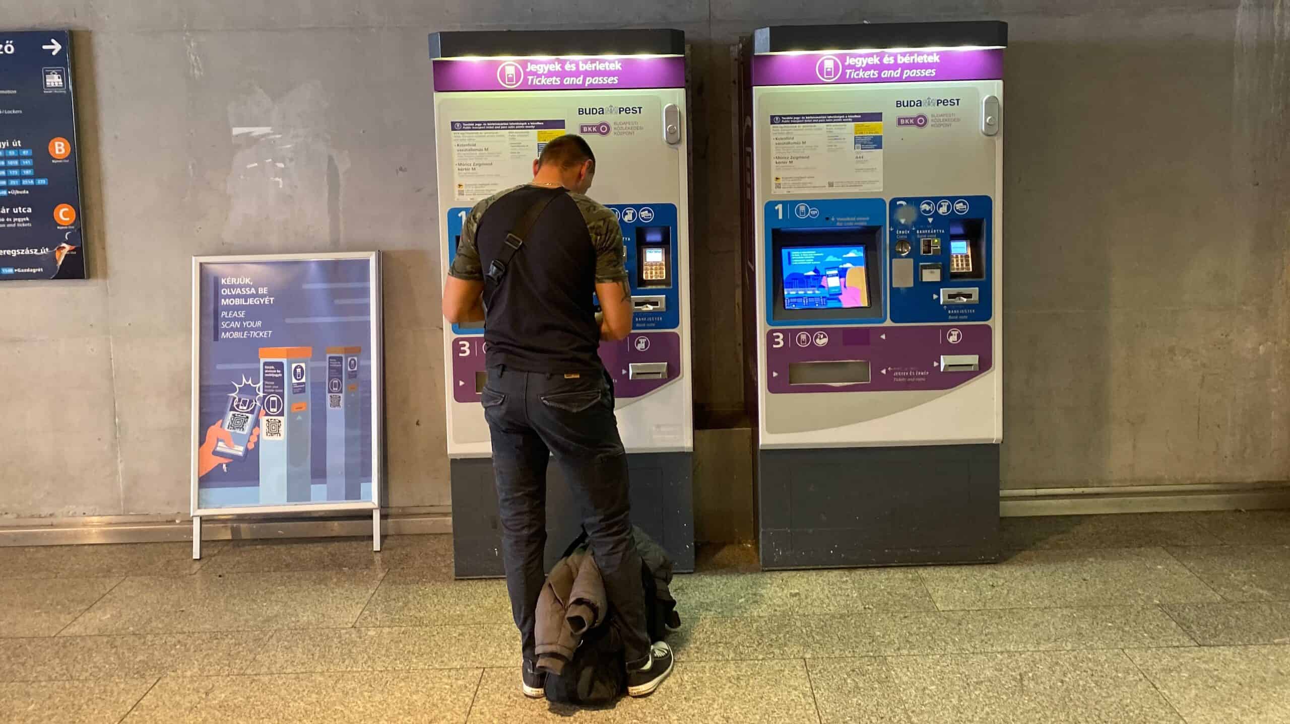 The interior of a Budapest tram showing the ticket validation machines