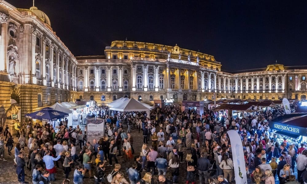 Massive crowds tasting wine at the outdoor Budapest Wine Festival in Buda Castle