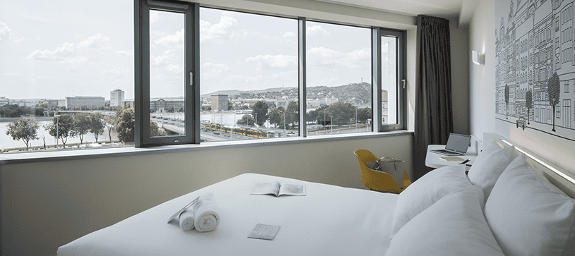 Young travelers relaxing in the stylish communal area of a budget accommodation in Budapest