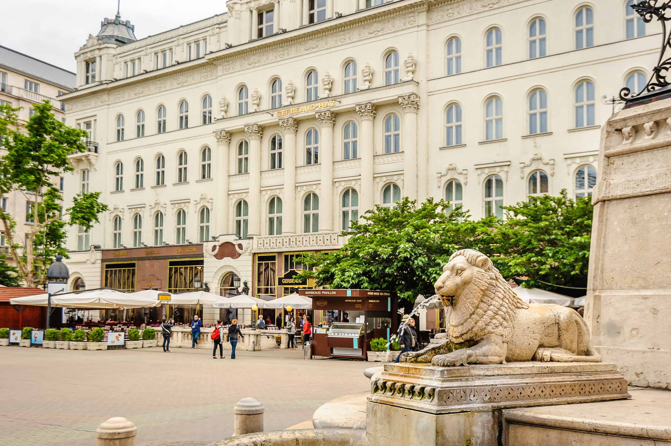 The famous Café Gerbeaud and grand lion fountain in Vörösmarty Square