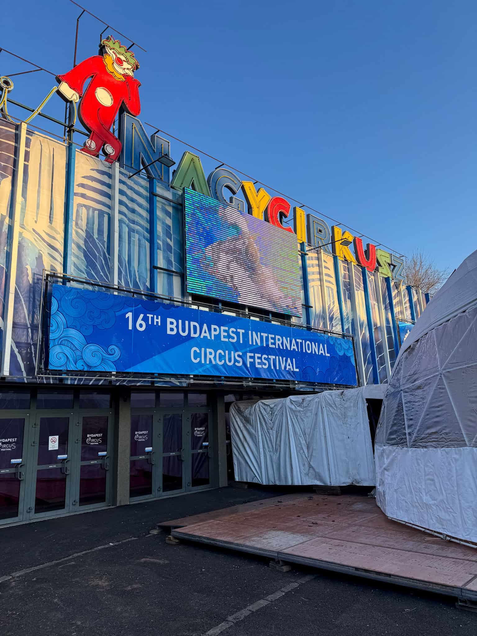 The exterior of Fővárosi Nagycirkusz with festival banners