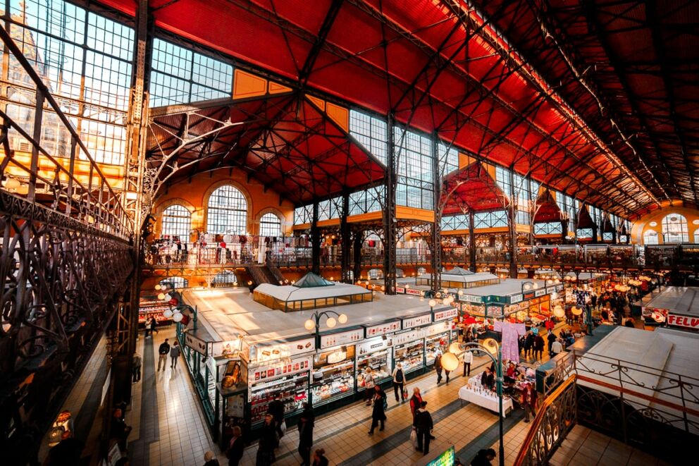The busy interior and vendor stalls of the Central Market Hall in Budapest