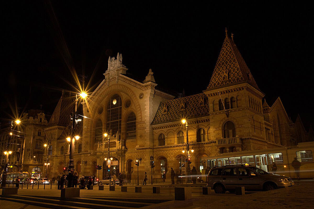 The Central Market Hall illuminated warmly by floodlights at night