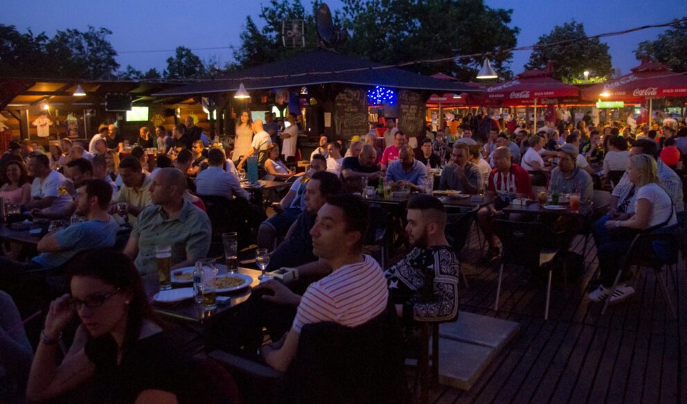 The outdoor terrace and sports viewing area at Champs Sziget on Margaret Island