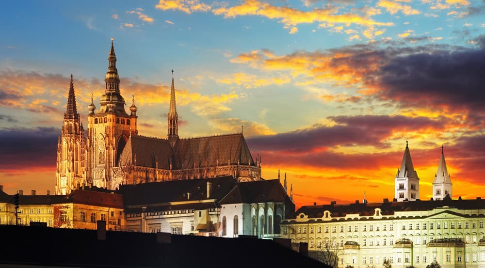 Crossing the historic Charles Bridge looking up towards Prague Castle