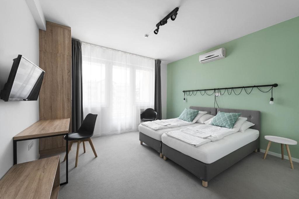 A compact, clean, and modern budget hotel room in Budapest