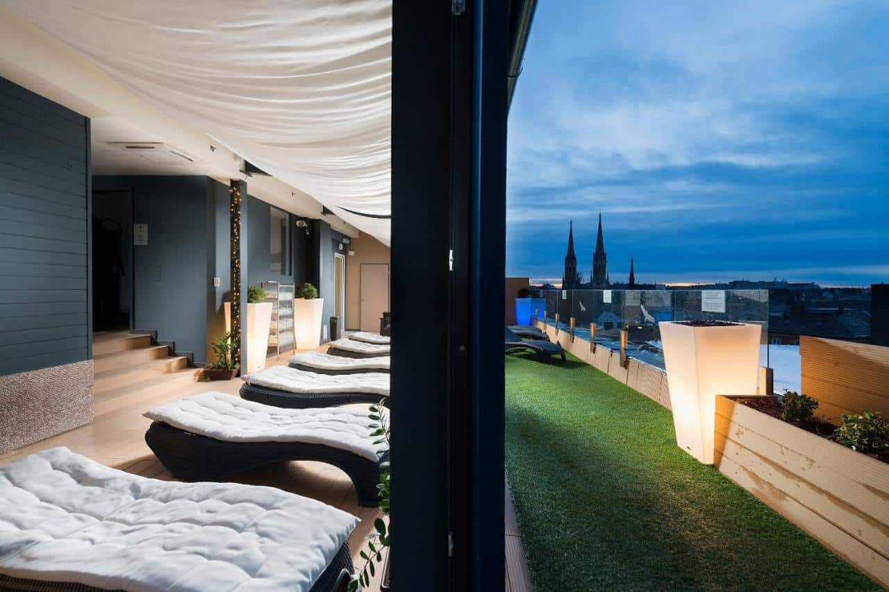 Children engaging in supervised craft activities inside a brightly colored hotel kids' club