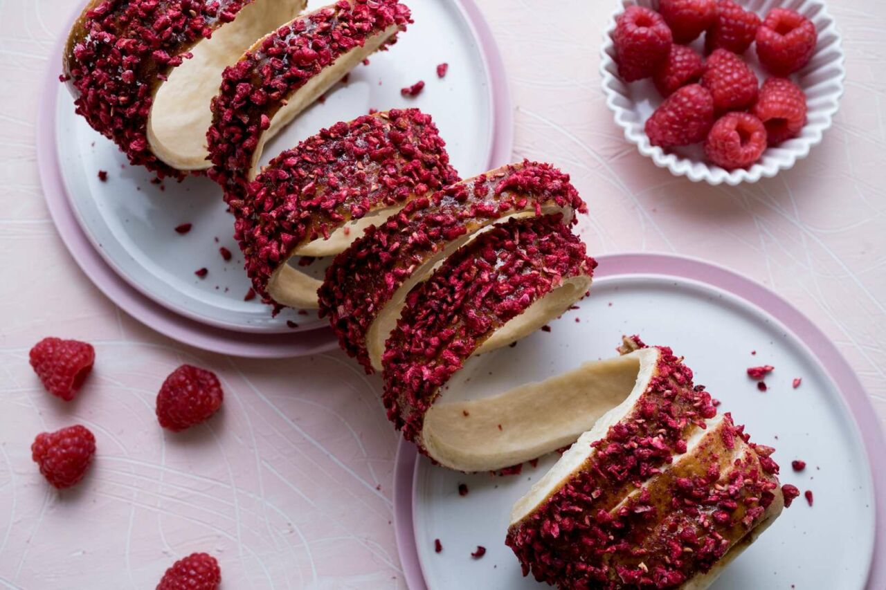 Sugar bubbling and caramelizing on the surface of a baking chimney cake