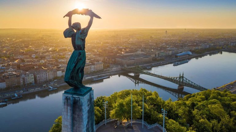 Liberty Statue Budapest shot from above, overlooking the Danube and Liberty Bridge at sunrise