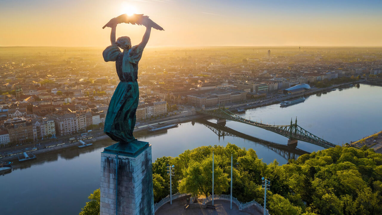 Liberty Statue shot from above, overlooking the Danube and Liberty Bridge at sunrise