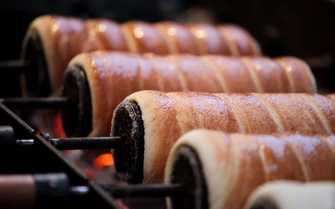 A freshly baked, classic cinnamon Hungarian chimney cake standing upright