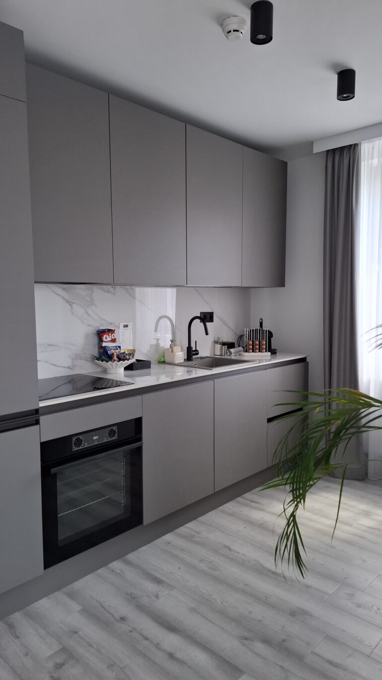 The softly lit, moody interior corridor of the Hotel Collect