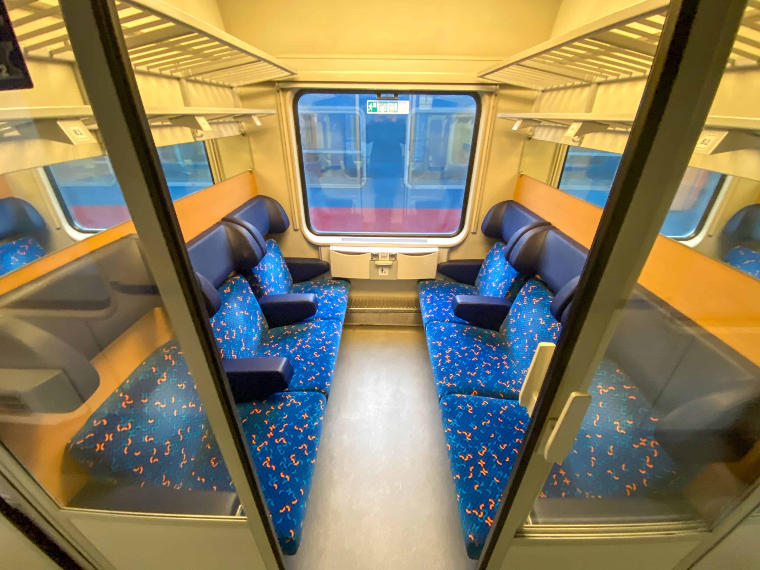 Comfortable seating arrangement inside a second-class EuroCity train car
