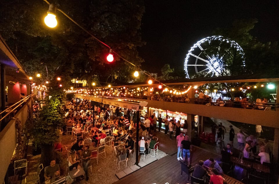 A massive, dense crowd of people partying at Fröccsterasz on a summer night